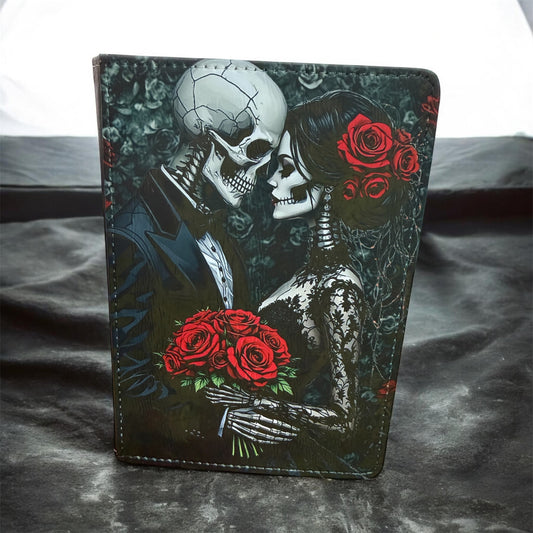 sublimination journal with skeleton couple design holding red roses on a dark background